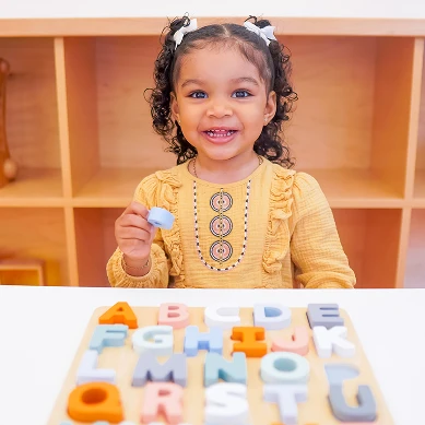 Child working on a learning activity at Playgarden Prep
